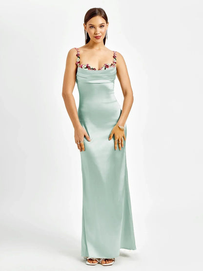 Femme Robe de Soirée Longue Slim Fit sans Manches avec Encolure Bénitier et Ornements Floraux