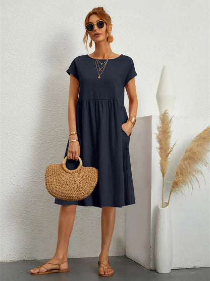 Femme Robe Midi Manches Courtes avec Col Rond et Poches Latérales