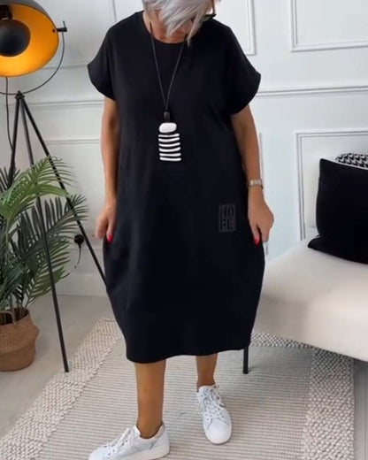 Femme Robe Midi Manches Courtes Oversize avec Col Rond et Imprimé Lettres